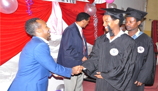 Ato Yonas Mamo, Executive director of alignAfrica, giving award for graduated students